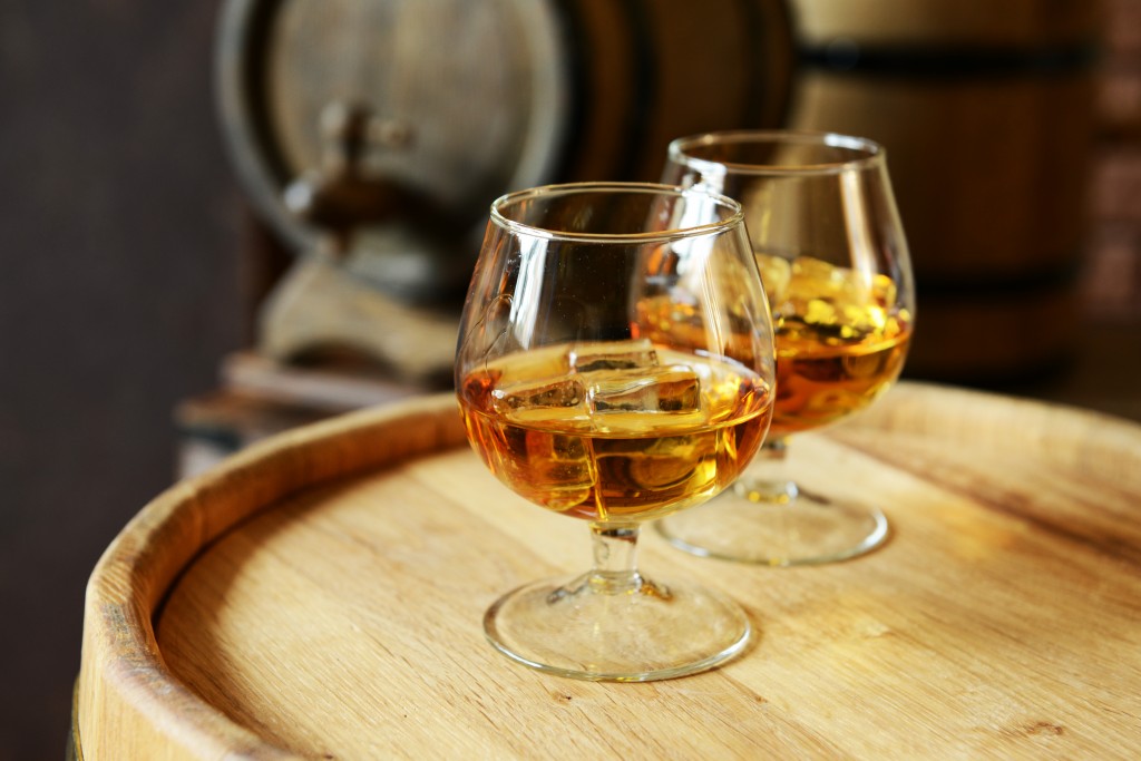 Fine wine and whisky have historically weathered financial market storms and shown resilience in times of uncertainty. Image: AdobeStock